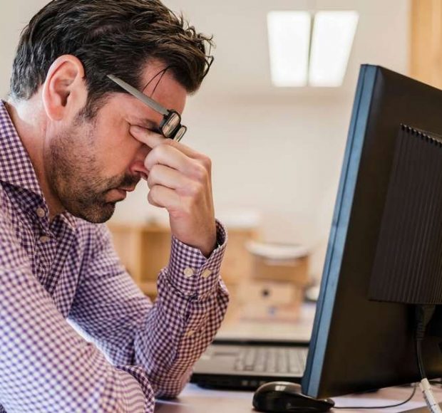 frustrated man at desk